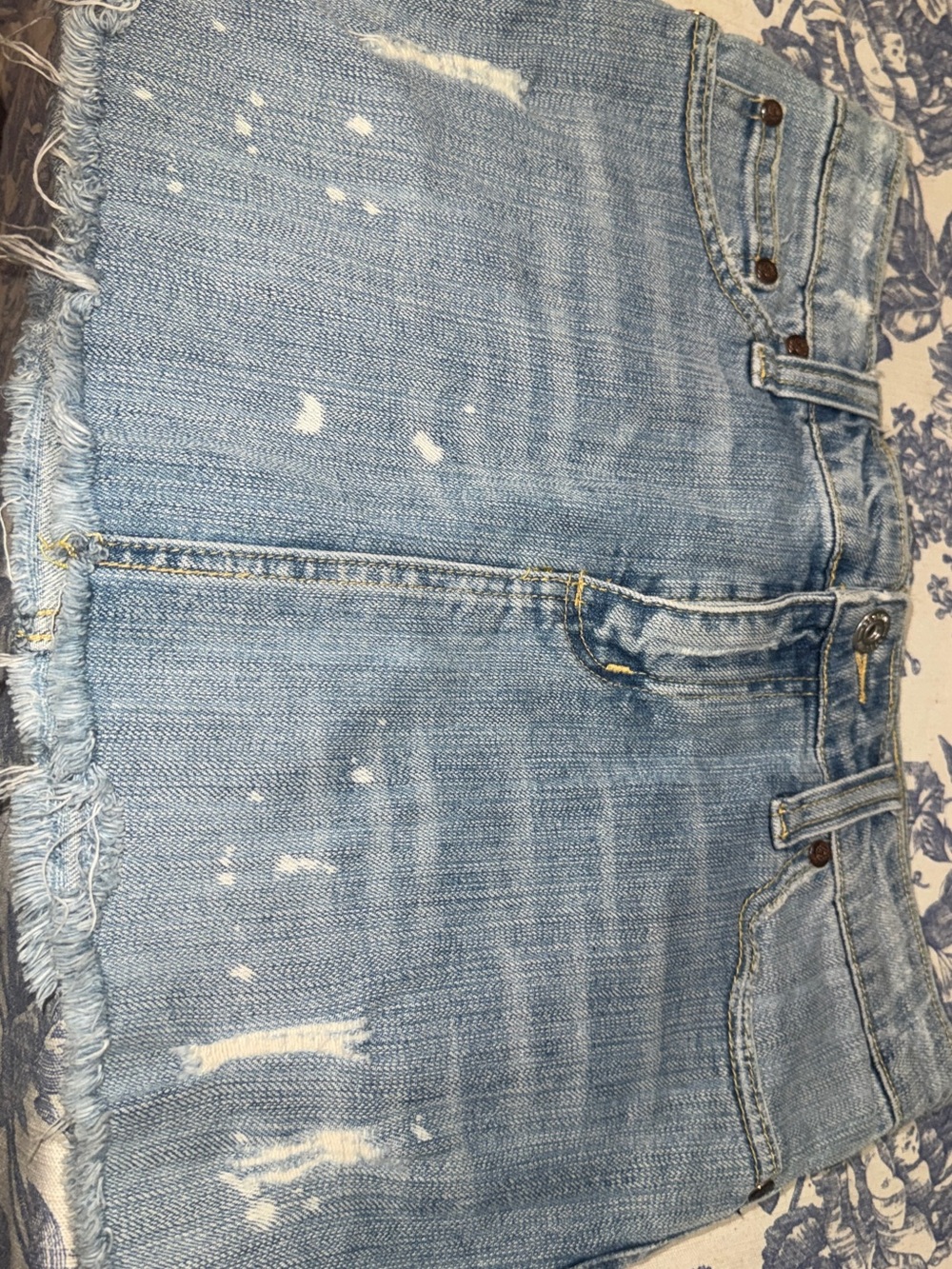 Light Wash Distressed Denim Mini Skirt
